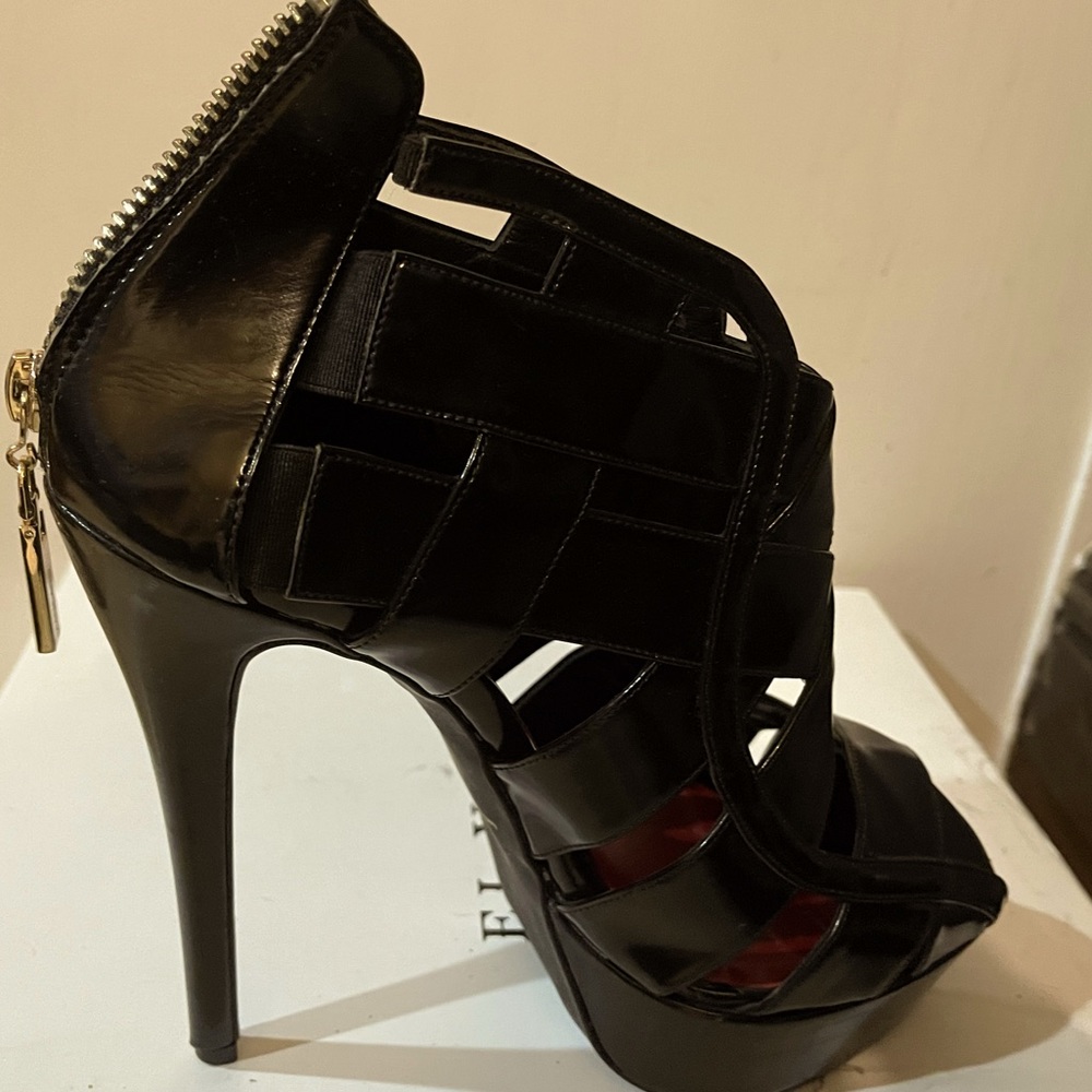 Mangano high heeled leather platform sandals. Made in Italy.
